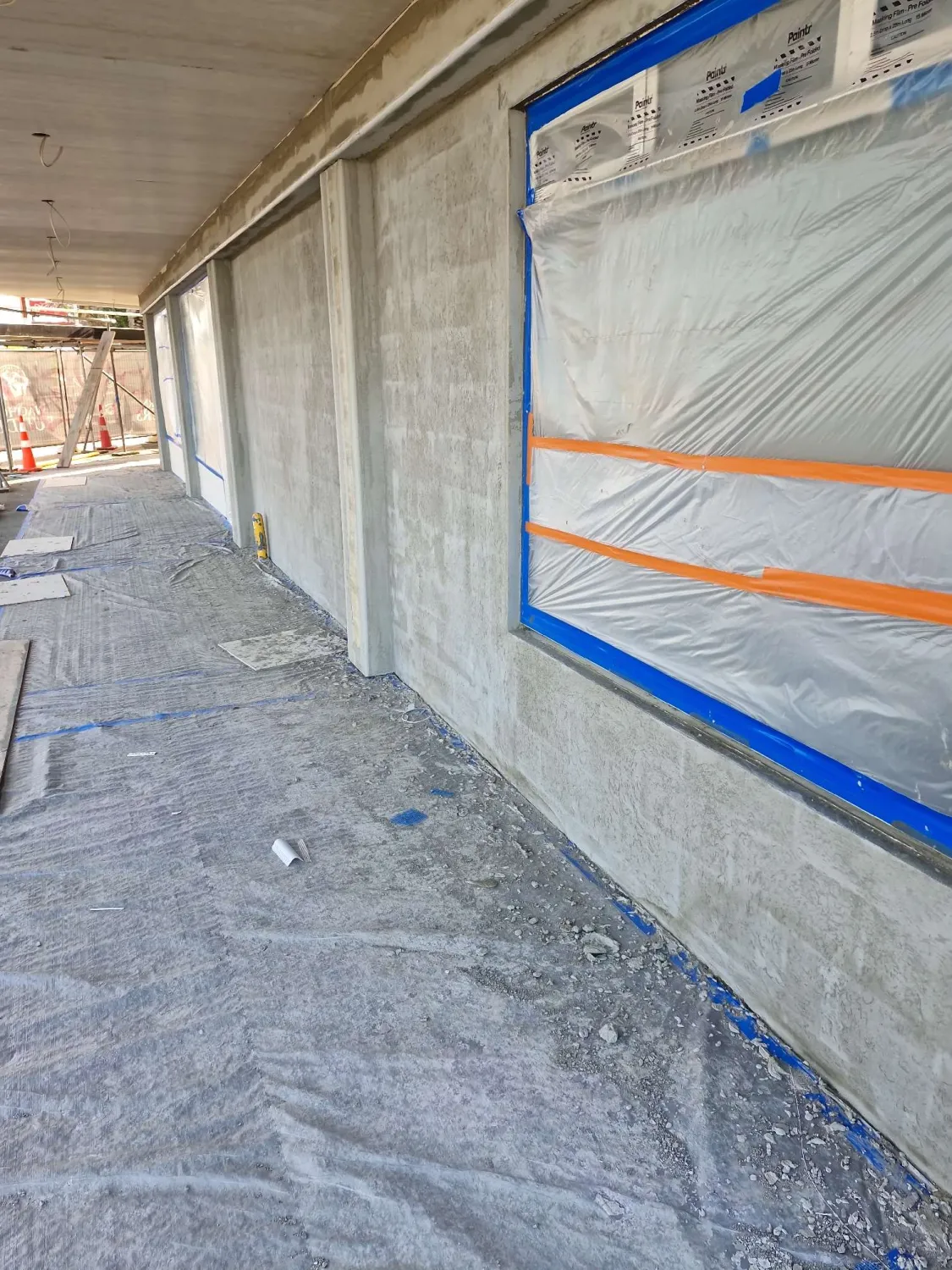 Commercial building before plastering — bare concrete block wall masked up